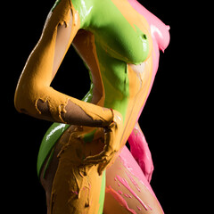 Naked woman in yellow and pink paint shot