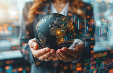 A businesswoman presents a glowing digital globe, depicting concepts of global connectivity and international commerce - obrazy, fototapety, plakaty