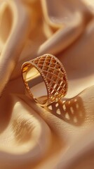 Elegant golden ring design on a soft backdrop. A luxurious and intricately designed 18K golden with 316L Stainless steel ring stands out against a creamy, soft background, bathed in gentle light