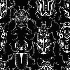 Seamless pattern with mystic decorated bugs against black background. 