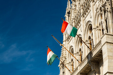Hungarian flags on the Hungarian Parliament Building or Parliament of Budapest, a landmark and...