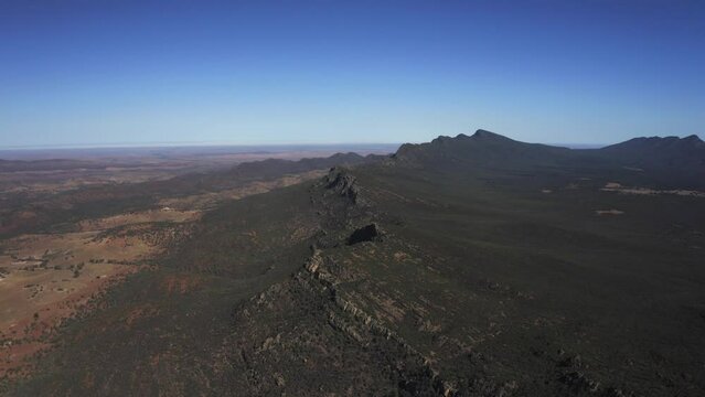 Aerial drone view of the vast land of Flinders Ranges, South Australia.
Surrounded by ancient mountain ranges, spectacular gorges and sheltered creeks, is one of the wildest destinations in Australia.