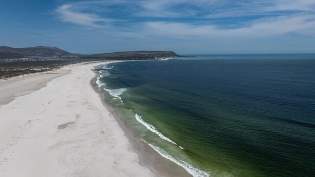aerial landscape view the famous, natural and very long Noordhoek Beach with white sand beach 