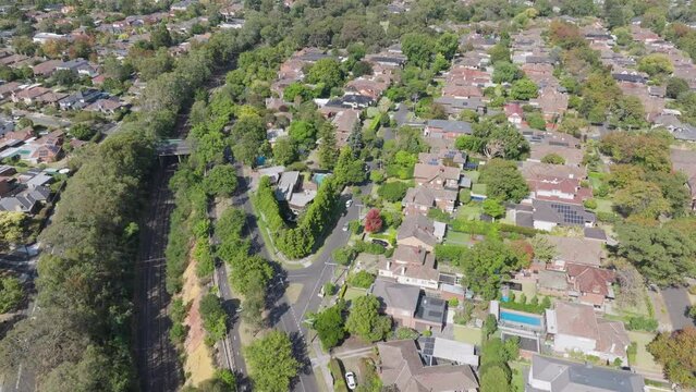 Aerial flyover of leafy middle class suburb