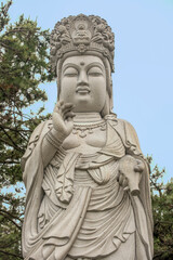 Fototapeta na wymiar Buddha statue at Haedong Yonggungsa Temple in Busan, South Korea, April 2017