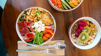  Three Bowls Filled With Different Types of Food