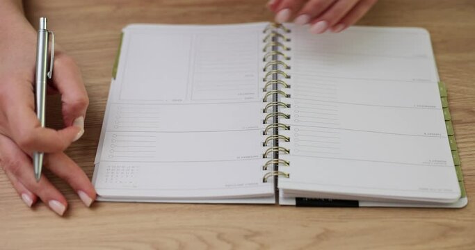 Woman open and flips through diary concept