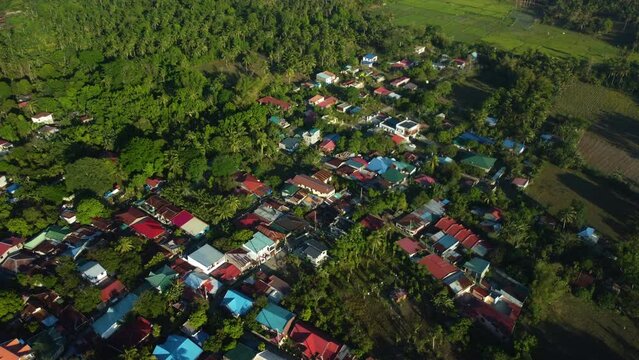 Aerial view around colorful dwellings of San Pablo, sunny day in Laguna, Philippines