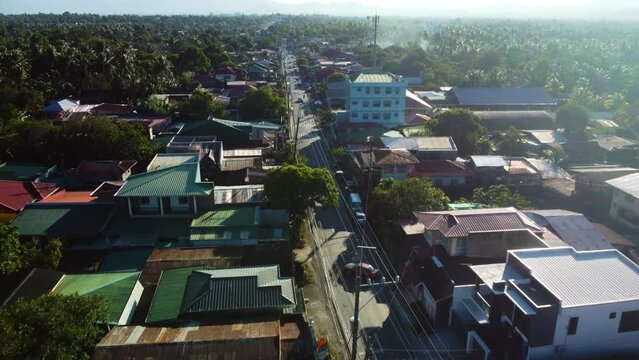 Aerial view following a road, sunny day in San Pablo, Laguna, Philippines