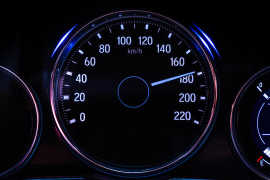 Digital car speedometer needle, high speed 180 kilometers per hour. Technology and transportation concepts - Powered by Adobe