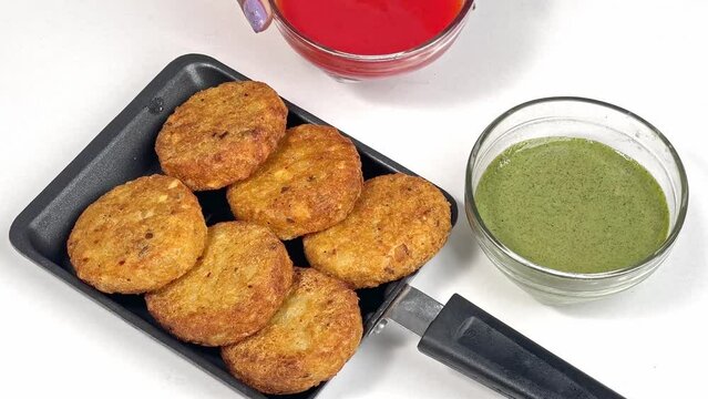 Aloo Tikki Indian snack Potato Patties served with cilantro chutney