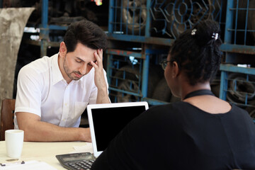 Unhappy man feels confused by employee description the prices of services and products in auto...