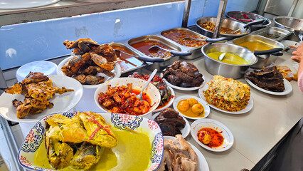 Warung Nasi Padang, Padang rice curry one of the most famous meals to be associated with Indonesia,...