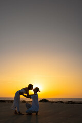 Vertical view of Romantic couple against sundown light in countryside