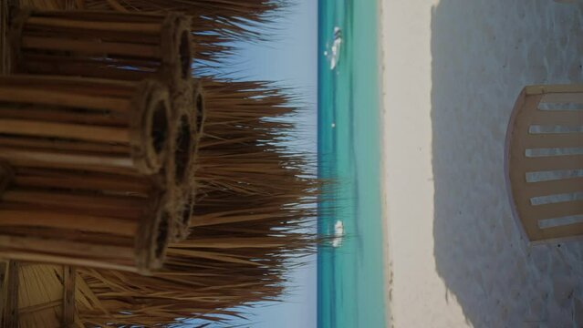 Tropical destination lounge on Bahia de las aguilas beach with view on yachts
