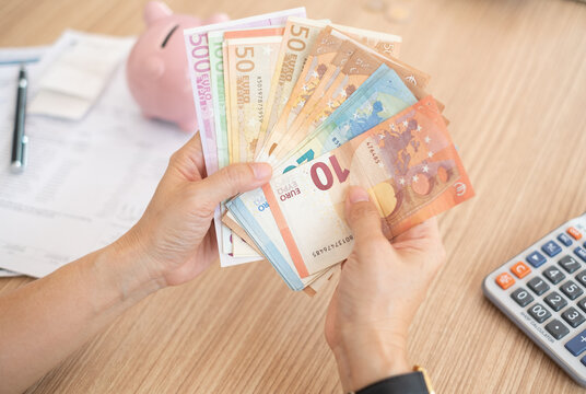 Euro banknotes money on hand. concept of personal loan,home finance,income,savings.