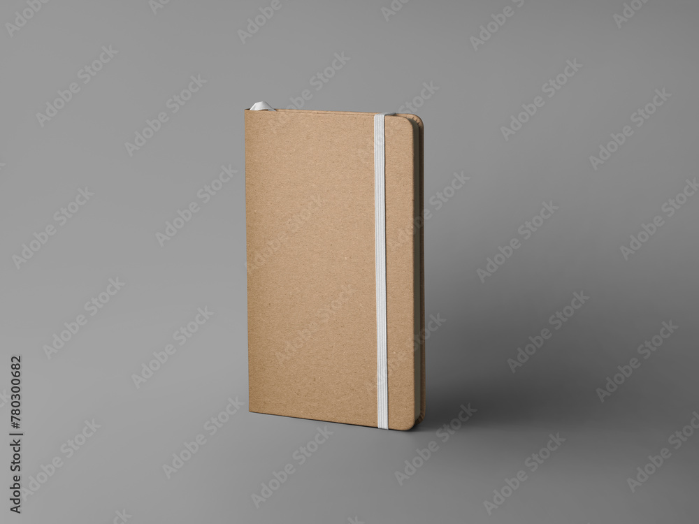 Poster mockup of closed craft notebook, standing on background with shadows, with white elastic band, bookm
