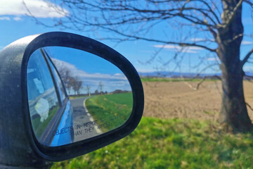 rear-view mirror in the spring landscape