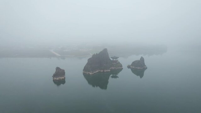 Dodamsambong Peaks Danyang Korea Drone Footage of peaks in river with pagoda and f og