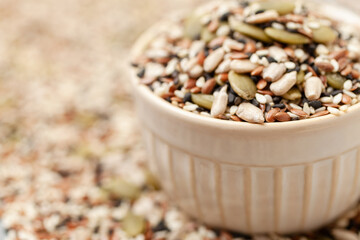 Seeds mix in bowl. Sunflower, black and white sesame, flax and pumpkin seeds
