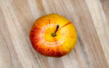 Gala apple on wooden board