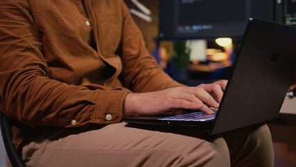 Remote programmer starting job shift in personal office at home, taking laptop out of bag....