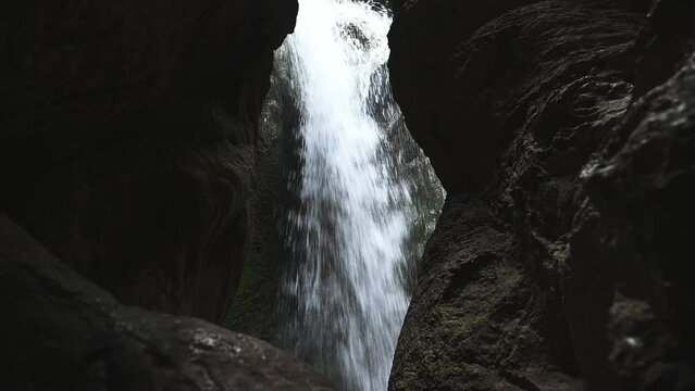 A clean fresh water flowing from a source in the cave in mountains. Waterfall in mountains of La Sierra de Cazorla. Beauty in nature. Environmental conservation. Tourism. Discovering nature in Spain