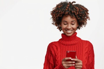 Portrait of smiling happy african american woman using smartphone isolated on white background, wearing red sweater with copy space for text or promotion banner.