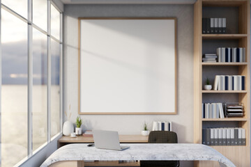 The interior design of a modern private office or home office features a laptop on a marble desk.