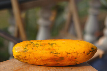 Whole of ripe papaya fruit on the table