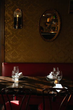 Dramatically lit dining room interior vertical