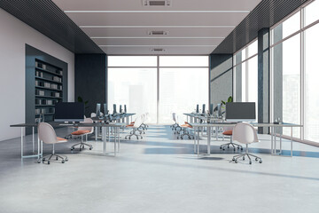 Modern bright coworking office interior with furniture, windows and equipment. Workplace concept....
