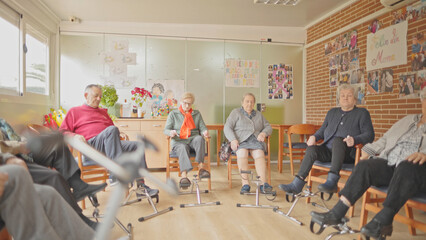 Elderly people engaged in light exercise at a senior center.