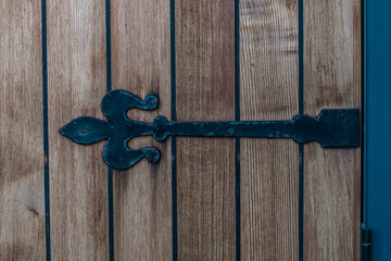 Ornate black detailing on wooden door