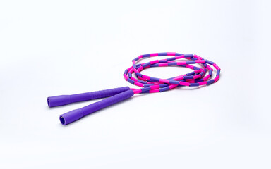 purple and pink skipping rope isolated on white background