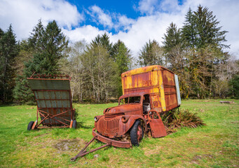 Fototapeta na wymiar Broken Down Rusty Cargo Box Truck at The Historic Kestner Homestead farm in the Quinault Rain Forest area of Olympic National Park, Washington State