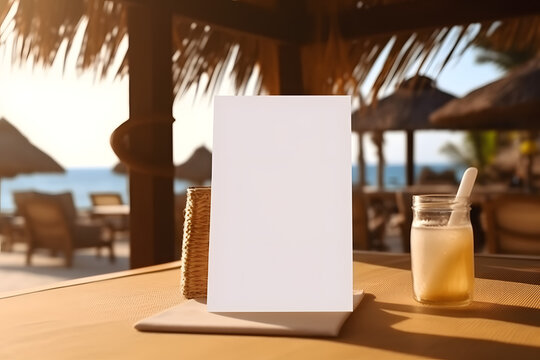 Blank menu frame on a wooden table in a beach bar restaurant. Mockup for display of design. Summer vacation and dining concept with copy space. Close-up with a blurred background