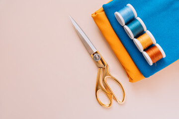 Various working tools and sewing materials on a light background.