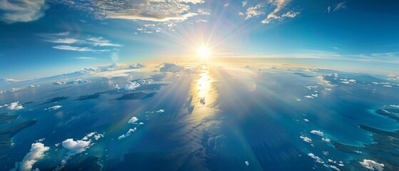 A breathtaking view of the Earth from space, with the sun casting its warm glow over an expansive ocean and land mass. The blue sky is dotted with clouds, creating a serene atmosphere that captures na - Powered by Adobe