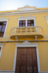 Old yellow house in a Spanish town - 780359453