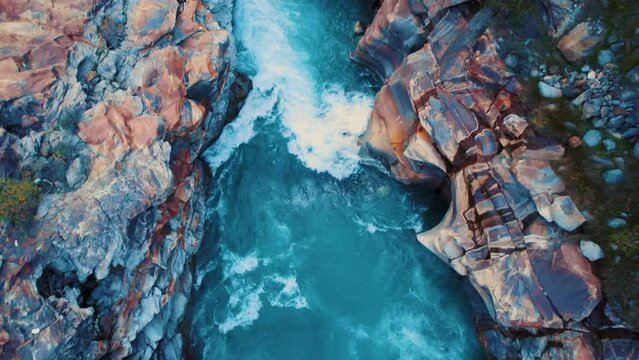 4K bird eye view of Pure clean blue water river in Himalayas. Bhaga river during summer at Lahaul, India. Beautiful aerial view of the river. Aerial Top Down Drone Shot. 