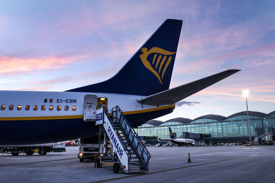 Passengers getting off the plane of Ryanair company at Alicante Airport