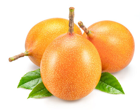 Granadilla fruits with leaves close up. The sweetest passiflora fruit or passionfruit.