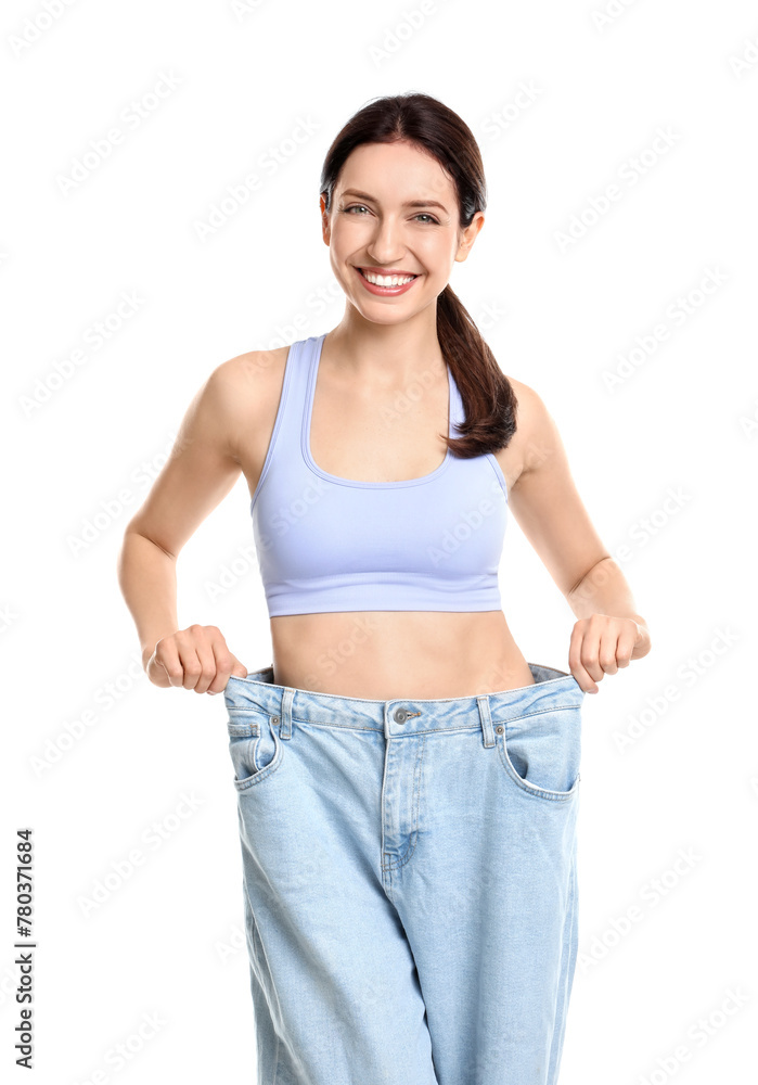 Sticker Happy young woman in big jeans showing her slim body on white background