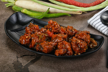 Manchurian chicken with sauce and spices