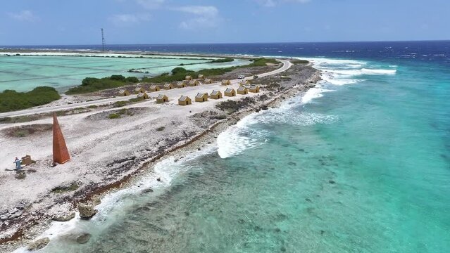Red Slave Huts At Kralendijk In Bonaire Netherlands Antilles. Island Beach. Blue Sea Landscape. Kralendijk At Bonaire Netherlands Antilles. Tourism Background. Nature Seascape.