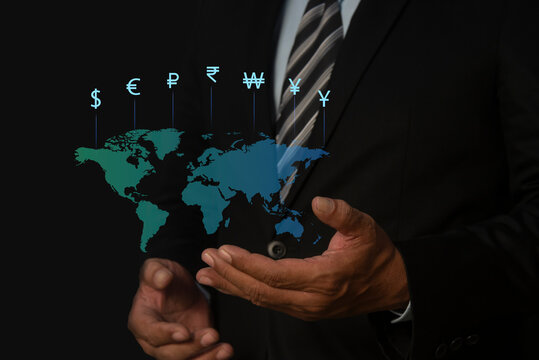 Businessman hand holding world with virtual line effect and dollar yuan yen euro and pound sterling sign. Global currency exchange concept