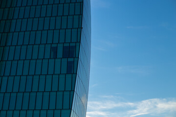 Skyscraper against the blue sky. Place for text. Glass buildings in Milan, Italy. CityLife Shopping...