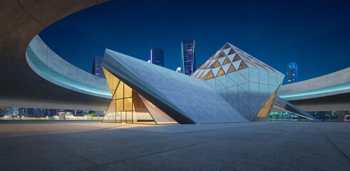 3D Modern architecture in the urban landscape at dusk with contemporary design and futuristic...