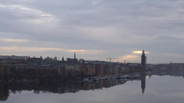 Stockholm, Sweden A view from the Western Bridge towards the City Hall and Gamla Stan and Riddarfjarden in the early morning. 